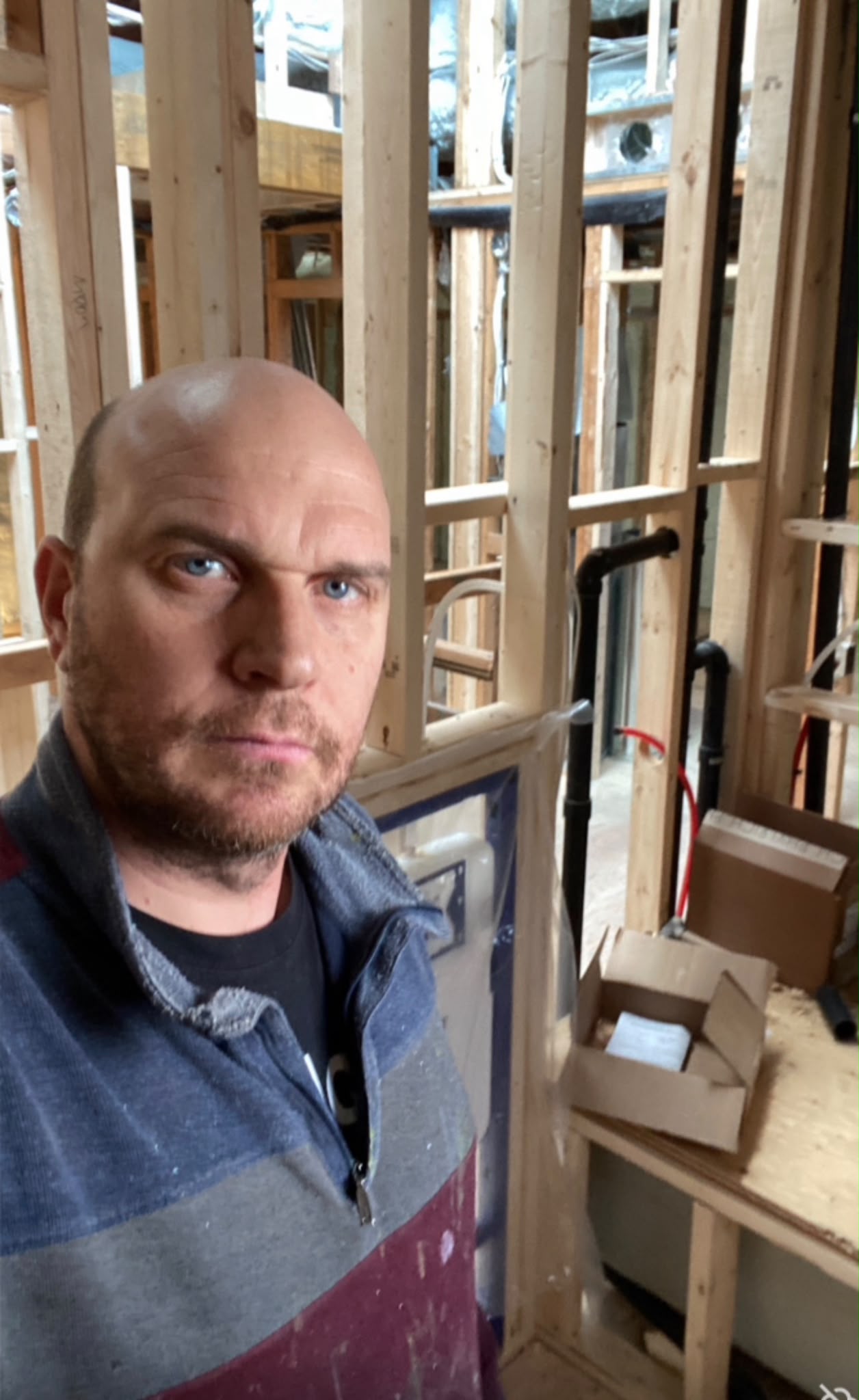 Roberto Carpentieri working on a plumbing installation